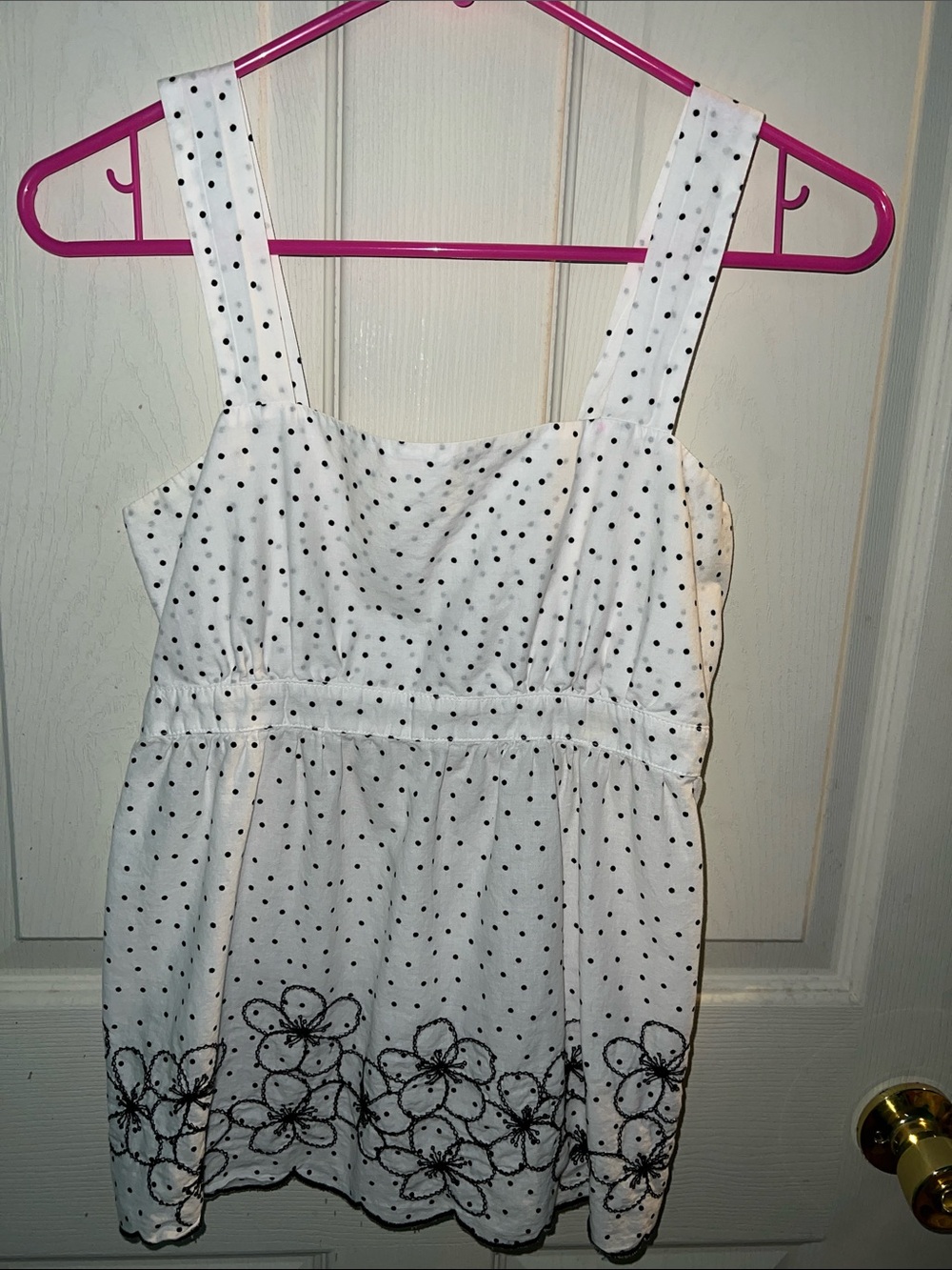 White Polka Dot Sleeveless Top with Floral Hem